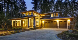 Luxury home lit up at sunset